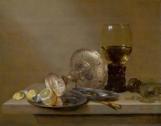 Willem Claesz. Heda - A vanitas still life with a broken roemer, an upturned tazza and a peeled lemon, all on a ledge