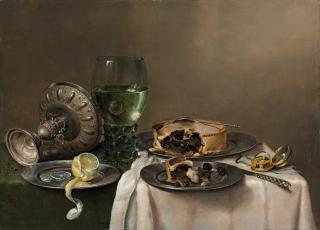 William Claesz Heda - A \'pronk\' still-life, with a roemer, an upturned silver tazza, a half-peeled lemon on a pewter plate, with a pie, a timepiece and a knife