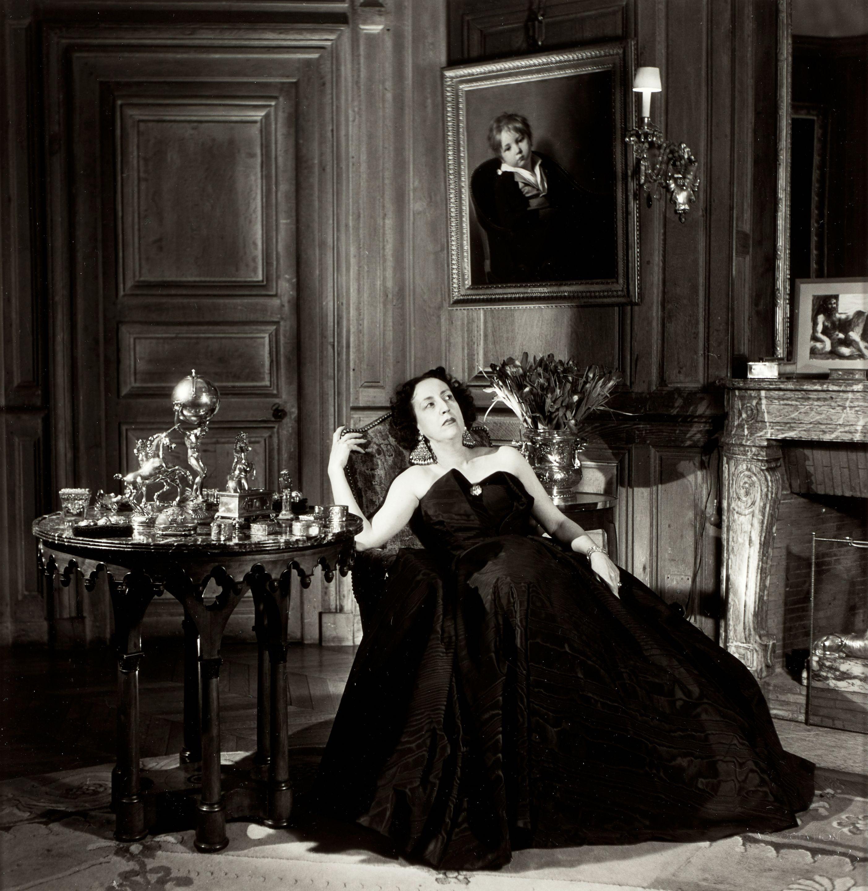 Willy Maywald - Le Vicomtesse de Noailles Marie-Laure Wearing a Jacques Fath Gown in Her Living Room