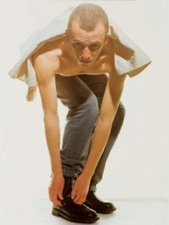 Wolfgang Tillmans - Adam doing up boot, 1991